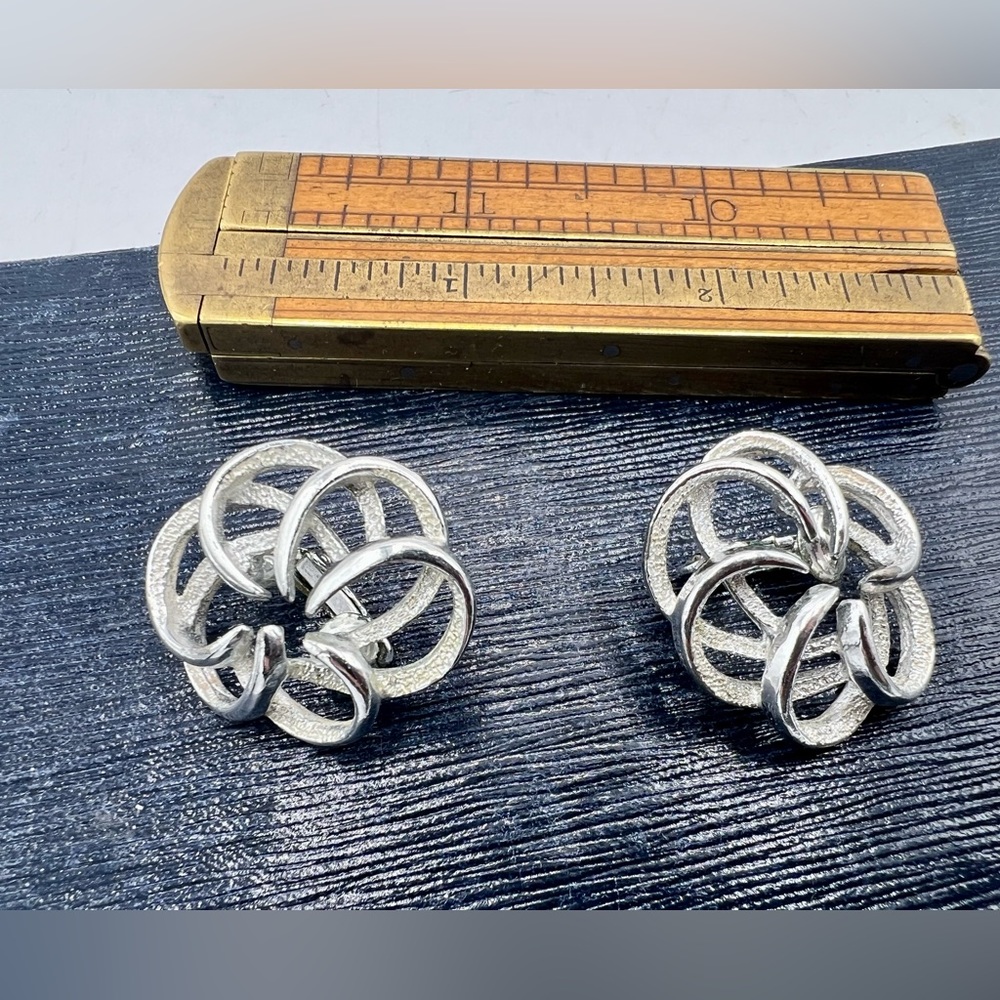 Vintage SARAH COVENTRY clip on silver tone curvy clouds earrings